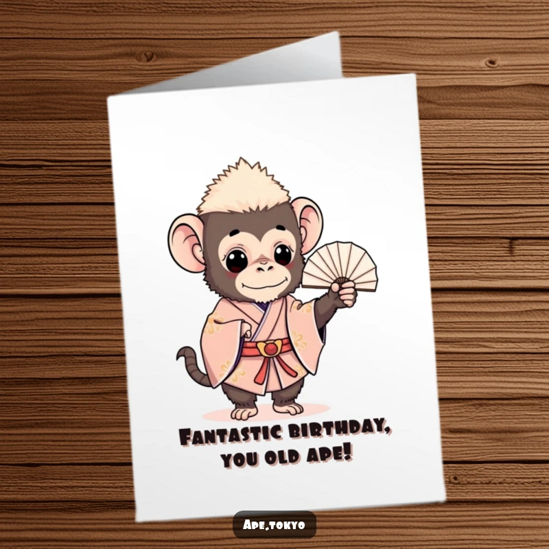 Funny Free Printable Birthday Card: Charming ape in a ceremonial kimono gracefully holds a delicate fan, designed for laughter.