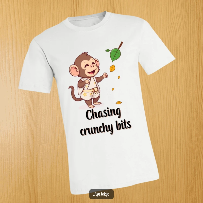 Funny T-Shirt: A goofy ape in a short kimono playfully tries to grab a falling autumn leaf mid-air.